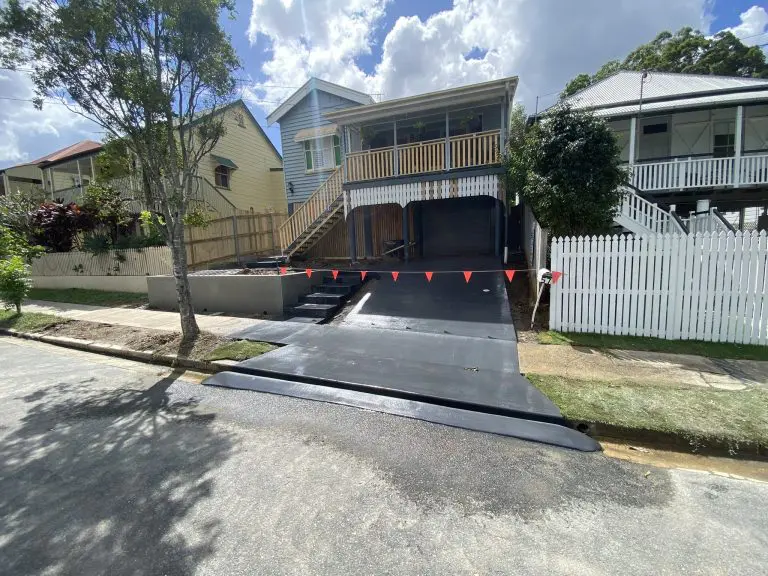 block work retaining wall with concrete core fill in Paddington and coloured concrete driveway with form steps and crossover complete 4